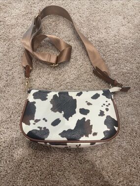 Cow Print Crossbody Bag with Brown Trim and Adjustable Strap